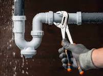Plumber repairing a pipe